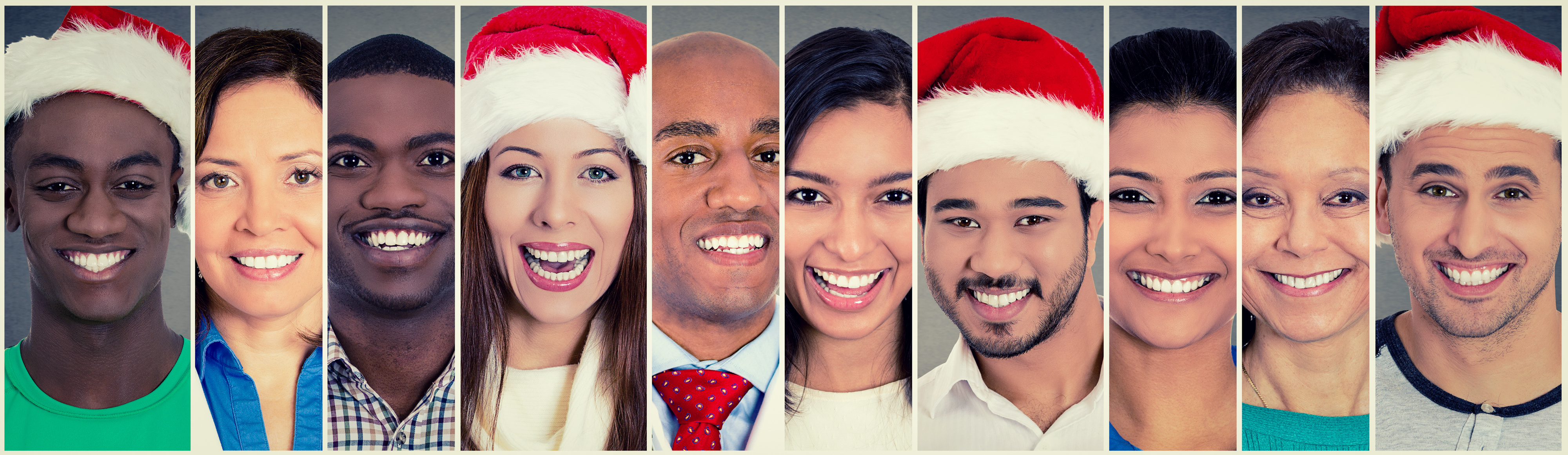 Smiling faces. Happy multi ethnic group of people some in Christmas Santa hat